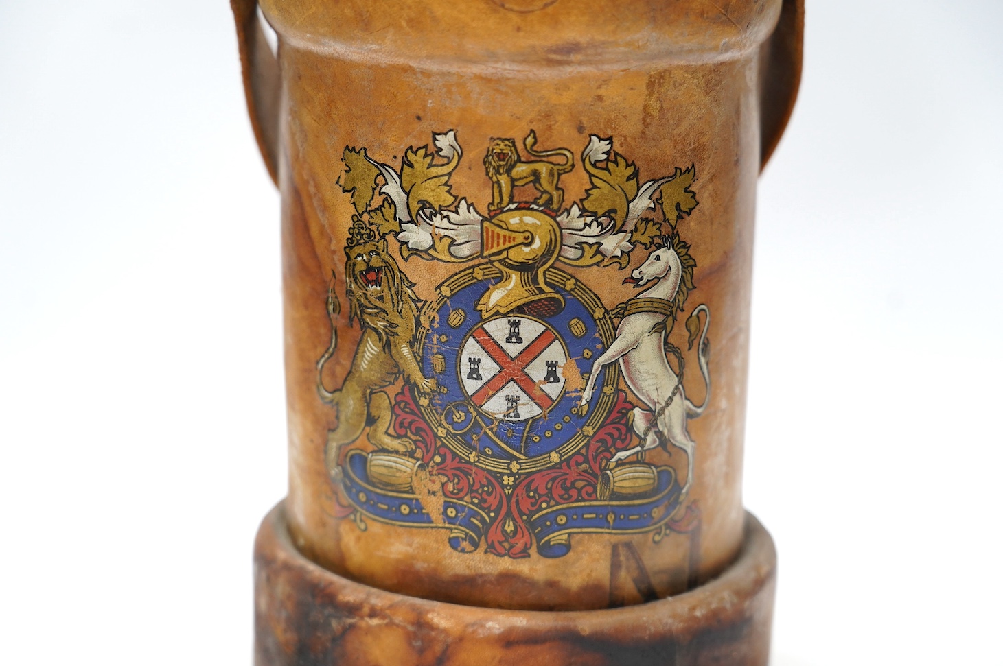 A leather powder flask, with painted Royal crest, 33cm high. Condition - poor to fair, some staining to the leather and wear at the edges